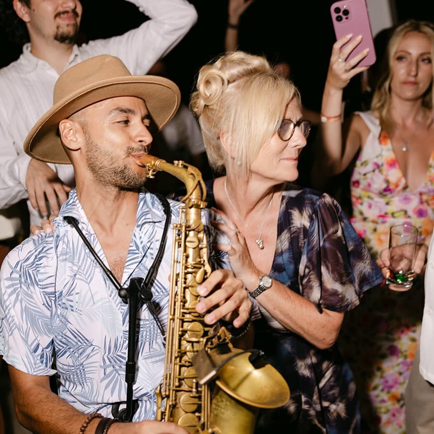 Victor Jazz playing flute at a luxury event in Cyprus